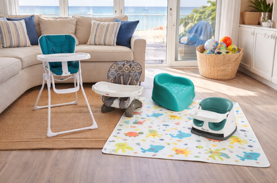 Coastal Baby Rentals feeding gear setup in a Jersey Shore beach house with high chair, booster seats, and splat mat near ocean view windows
